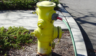 Garden hose connected illiegally to fire hydrant